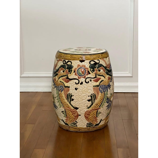 Mid 20th century Chinese dragon ceramic garden stool or side table. Invigorate a room with this boldly decorated stool...