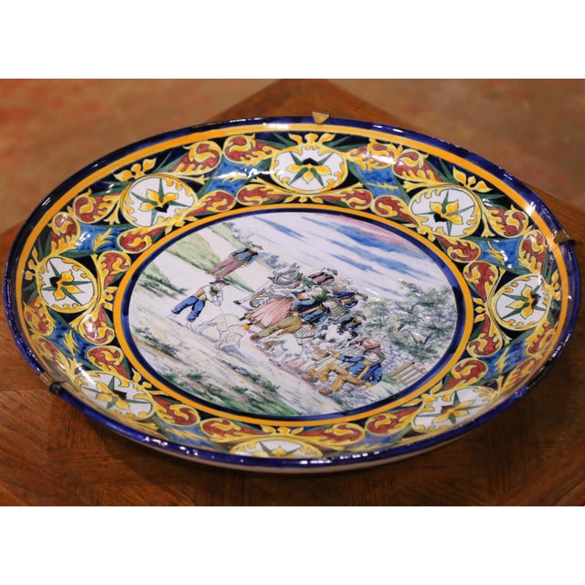 Dress a kitchen wall, dining room, or breakfast nook with this monumental antique French faience platter from Quimper,...
