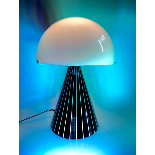 Three-layered opaline glass globe. The base is also made of glass. This piece has an attribution mark, I am sure that it...