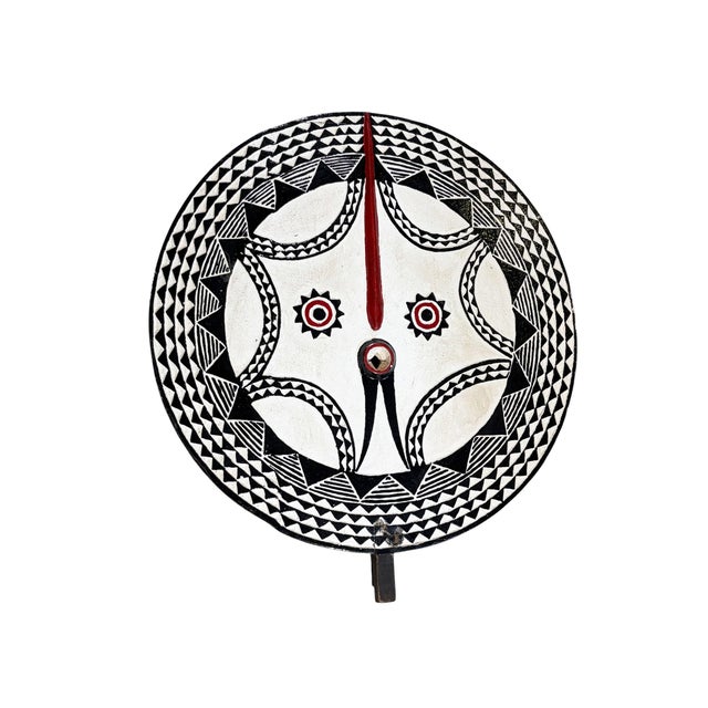 This striking vintage Bobo sun mask from Burkina Faso is hand-carved from wood and finished with an aged, multi-colored...