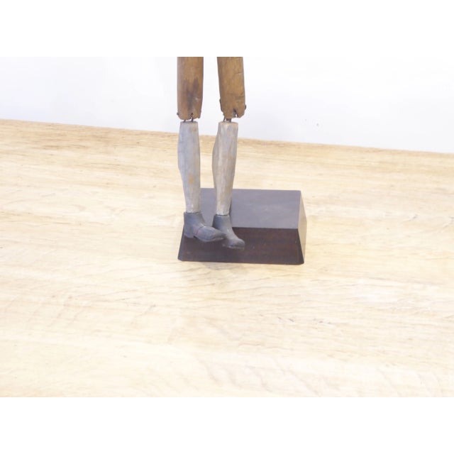 19th Century American wooden puppet like figure with moveable legs, mounted on new iron stand.