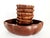 Offered is a set of eight 1970s clam-shaped carved and lathed Teak wood bowls made in Thailand. The large serving bowl...