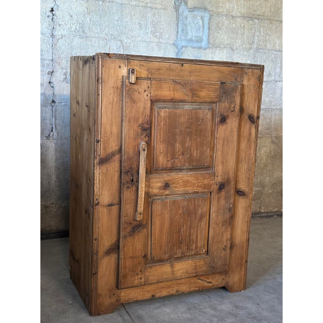 Primitive and charming, this 19th Century French cabinet made of solid pine would look darling in your chalet, or stylish...