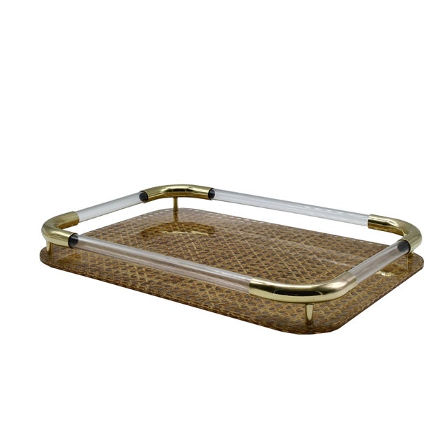 Beautiful mid-century rectangular serving tray in acrylic glass, brass and Vienna straw in the style of Christian Dior....