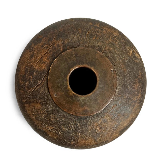 Antique old wooden tobacco container from India. Adorned with brass / metal decorative details. Each is unique and sold...