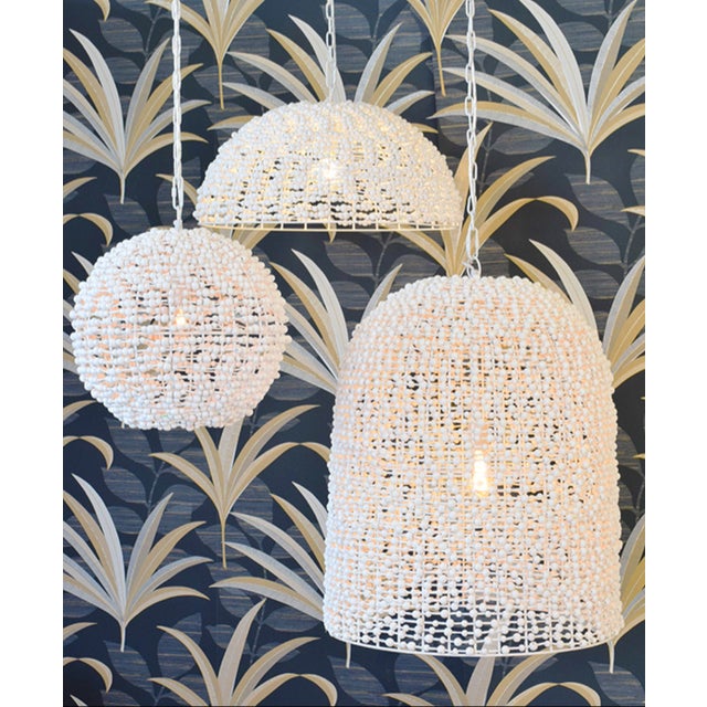 New special order item. Not vintage. The Arleigh Bell Pendant Light features a stunning wood bead design and a gorgeous...