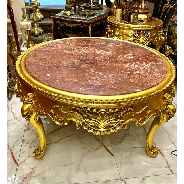 Make a statement with this impressive French-style round coffee table, featuring a substantial marble top framed by an...