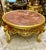 Make a statement with this impressive French-style round coffee table, featuring a substantial marble top framed by an...