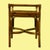 A small rattan wing bench with curved arms and a woven seat in warm honey tones. Compact enough for the foot of the bed,...