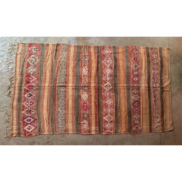 This vintage Moroccan rug is a true powerful women's artistic creation that is the first thing our eyes get caught when we...