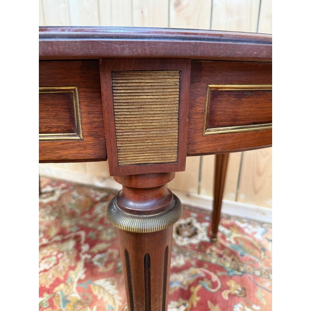 Louis XVI style oval mahogany dining table with two 50cm extensions each. Comfortable 63cm height under the apron. Two...