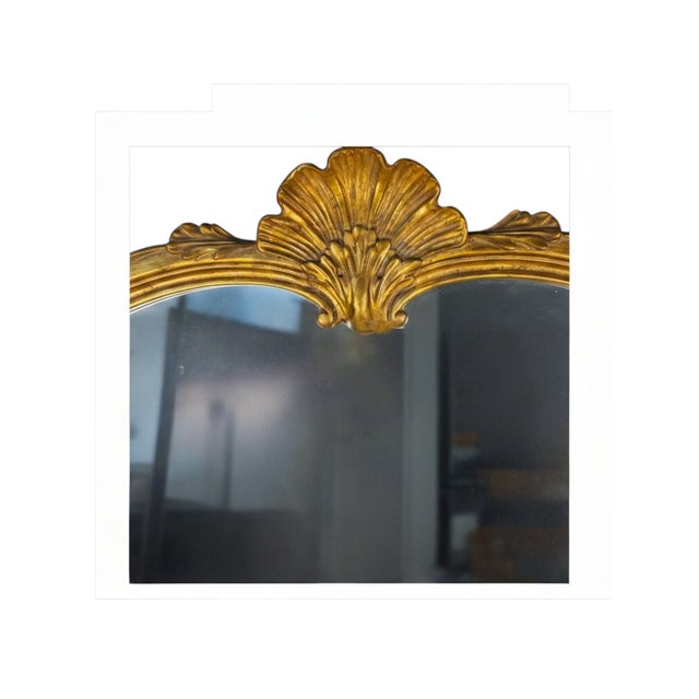 An elegant mid-20th-century French Provincial and Rococo Revival wall mirror by John Widdicomb, circa 1950s, featuring a...