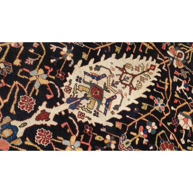 Rare and one-of-a-kind antique Persian Bakhtiar gallery rug. Dark blue field decorated with nomadic ornaments. Exquisitely...