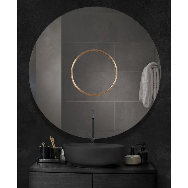 The Leanardo 54 round frameless mirror features a unique mirror within a mirror style. This artfully crafted design with a...