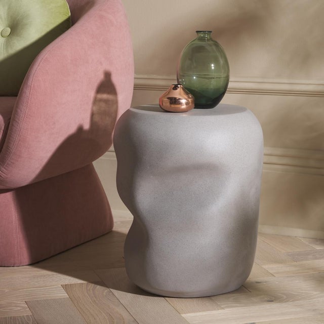 Give a contemporary update to your home with our stunning Carrick accent table. The solid body of the table is softened...
