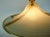 Impressive 70s hanging lamp made of eggshell -colored and transparent gold -colored acrylic and brass. Continuously...