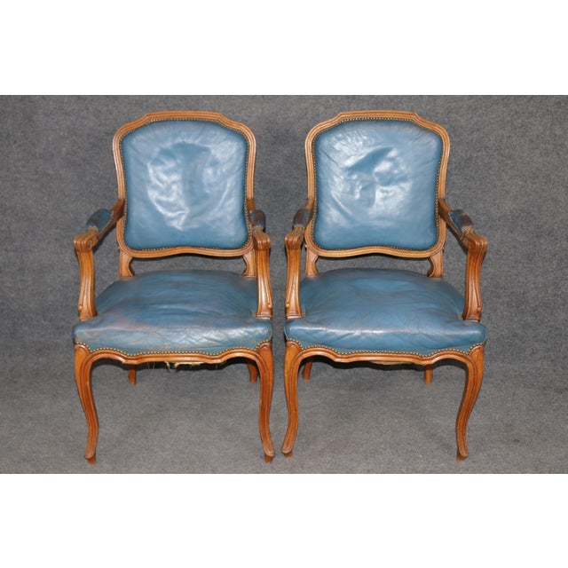This extraordinary set of 10 French dining chairs, crafted in the 1940s, carries that quiet authority of post-war European...