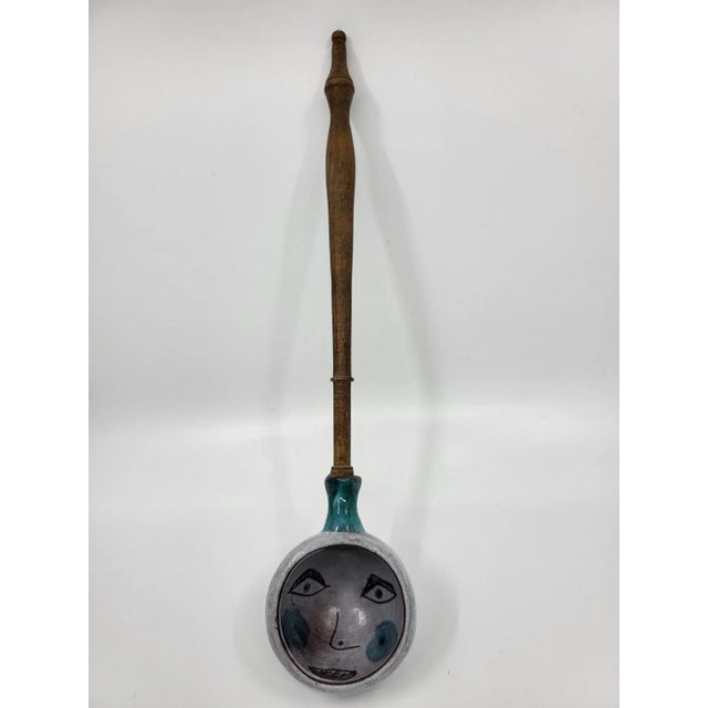 Punch or sangria ladle, the handle in turned stained solid beech, the hemispherical head in enameled ceramic with a pretty...