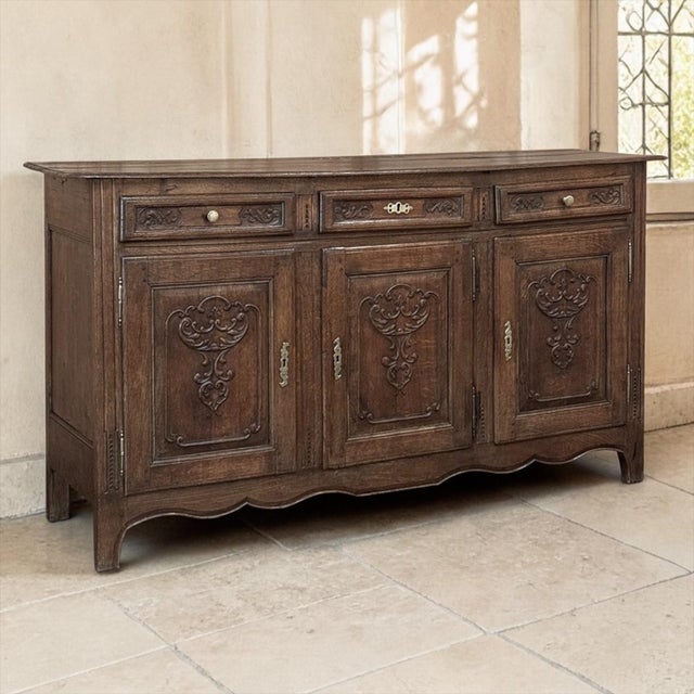 18th Century Liégeois Country French Oak Buffet was shaped by the practical beauty and regional craftsmanship of the Liège...