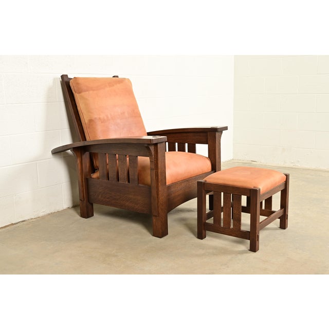 An exceptional Mission or Arts & Crafts bow arm Morris reclining lounge chair with ottoman By L. & J.G. Stickley USA, 1995...