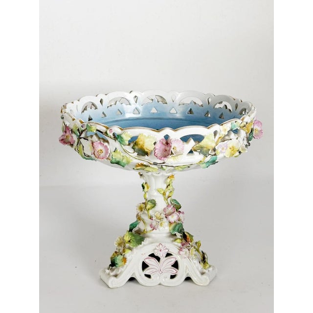 These are the dimensions of a single plate. Elegant German porcelain centerpiece dating from the 19th century, featuring...