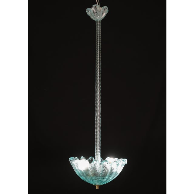 Elegant Murano glass pendant in a rare shade of blue. Dated to the 1950s. In perfect vintage condition, fully restored....