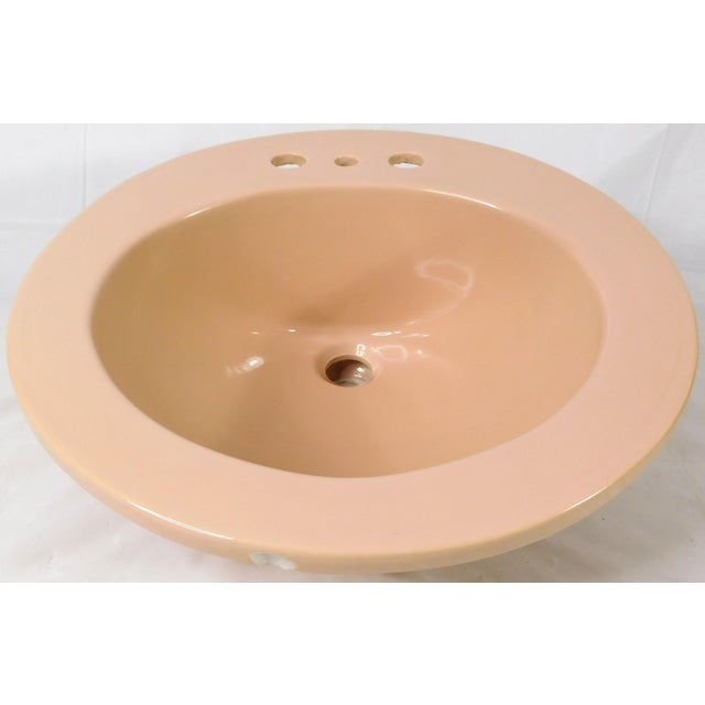 This sink is in very good overall condition, save for a few tiny dings and faint scratches on the visible portion. The...