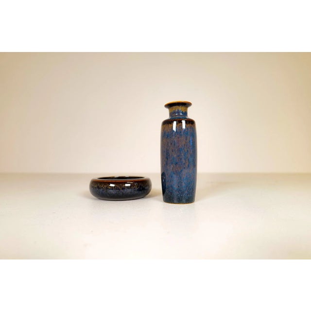Ceramic mid-century bowl with a matching vase manufactured at rörstrand and maker/designer carl harry stålhane. Made in...