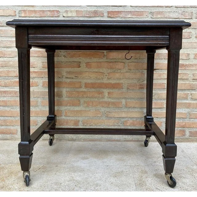 Mid-Century Modern French Wooden Table, 1960s Rectangular wooden cart. The legs are of square section. Its four legs have...