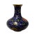 This is a traditional oriental Chinese vase made of metal and covered with purple blue enamel color. There is a floral...