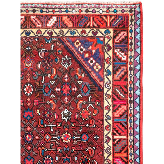 A vintage Persian hamadan rug from the mid-20th century. Hamadan town and the surrounding weaving area of about 120...