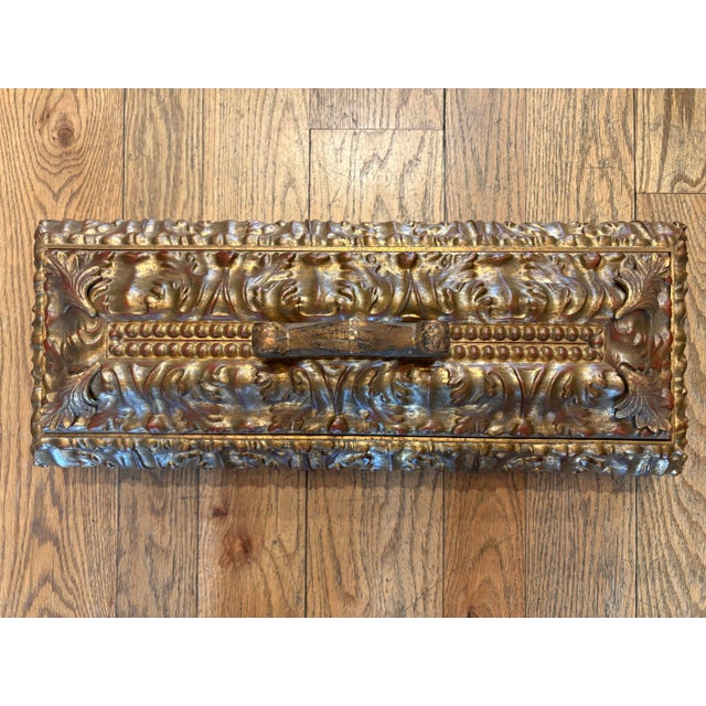 This jewelry box is made of wood and decorated in a Baroque revival style. It’s decorated with acanthus leaves, scrollwork...