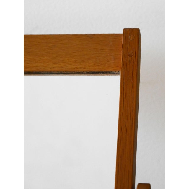 Swedish 1960s mirror with light teak structure and tilting support, produced by Fröseke. Table mirror produced by Fröseke,...