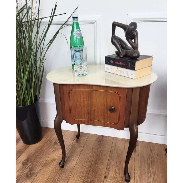 Very elegant and refined Italian Art Deco design, pair of bedside tables in kidney design shape with wood front door,...