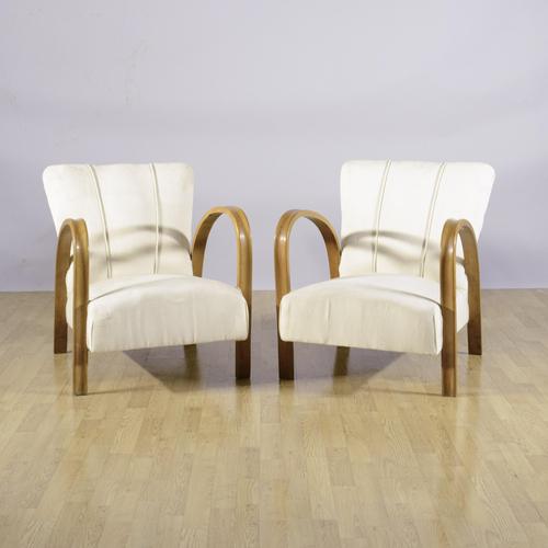 This refined pair of art deco armchairs, dating back to the 1930s, perfectly embodies the modernist aesthetic of the early...