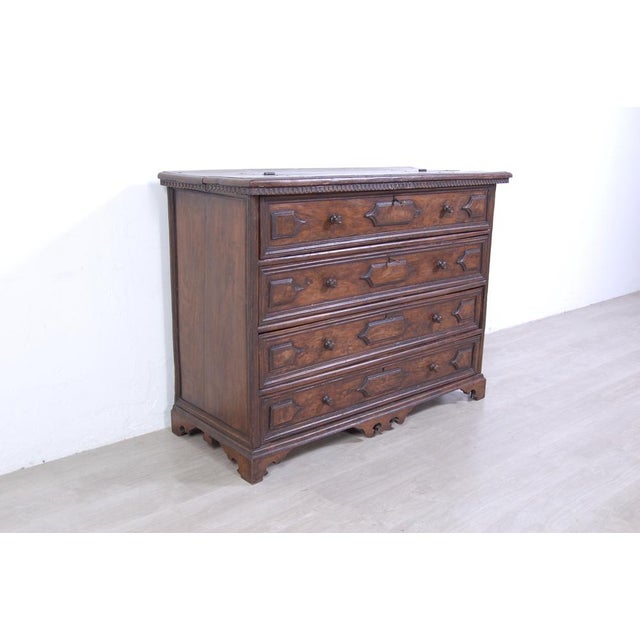 Massive chest of drawers made of walnut. The first drawer opens to show 6 small secret drawers. The top right drawer no...