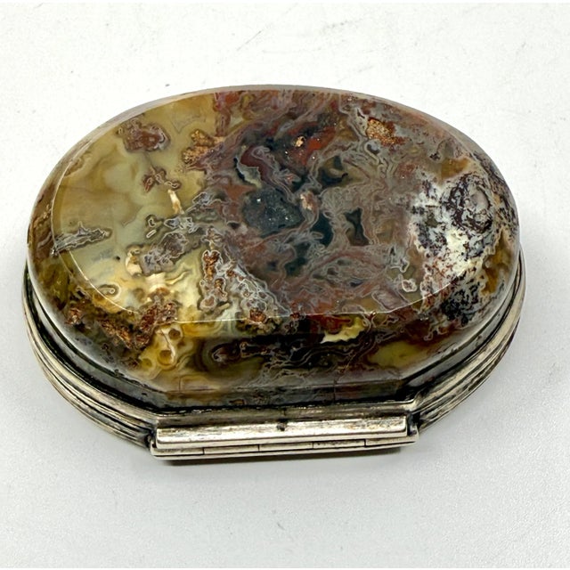 A nice group of three antique Victorian snuff or trinket boxes with metal sides and banded or moss agate tops and bottoms....