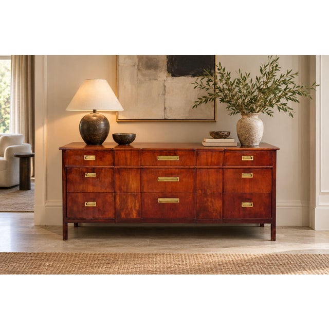 John Widdicomb, American Mid-Century Modern, Nine-Drawer Dresser, Walnut, Brass, USA, 1960s A modernist nine-drawer...