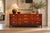 John Widdicomb, American Mid-Century Modern, Nine-Drawer Dresser, Walnut, Brass, USA, 1960s A modernist nine-drawer...
