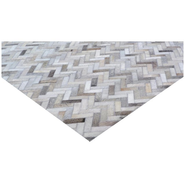 Carefully selected hair-on hide sections in various shades and colors are hand-stitched together to create a stunning and...
