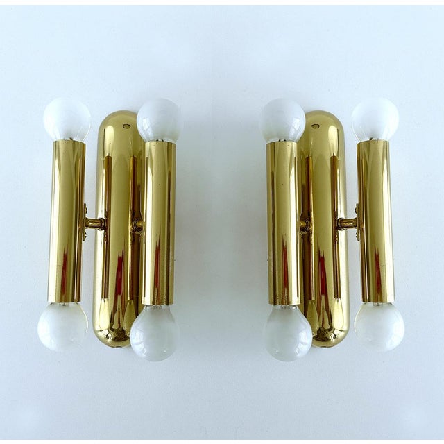 Pair of mid-century brass sconces with each 4 lights, reminiscent of sciolari designs dimensions 9.44 in. H x 5.11 in. W x...