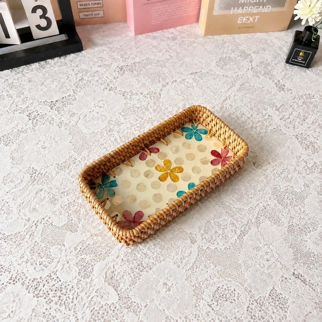 This set of three nested rectangular trays is made of natural rattan with colorful mother-of-pearl inlays. Craftsmen cut...