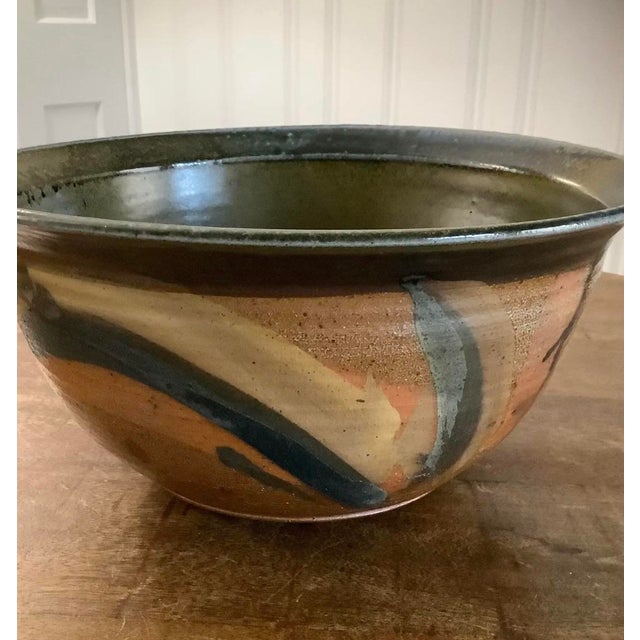 Lovely studio pottery centerpiece bowl in excellent condition. No damage or flaws. Colors and glaze are beautiful....