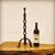 This French handcrafted lamp base features an openwork stem with three alcoves, resting on a base made of three curved and...