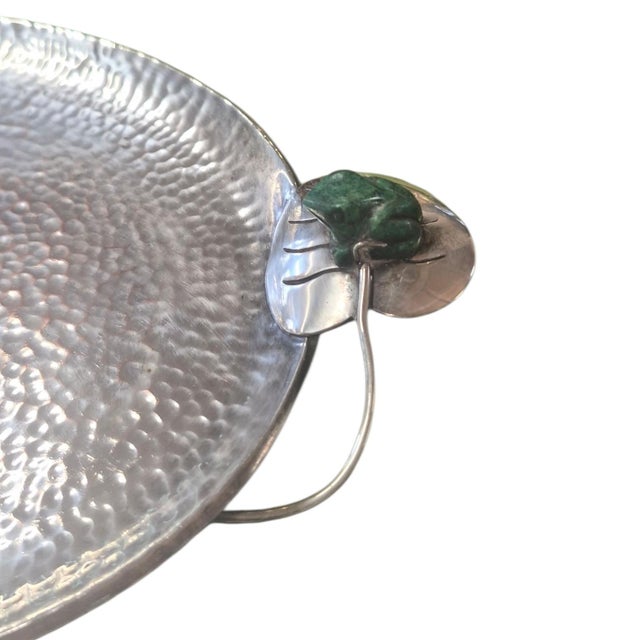 A serving tray by celebrated Taxco designer Emilia Castillo. With malachite frogs perched on lilly pad hndles
