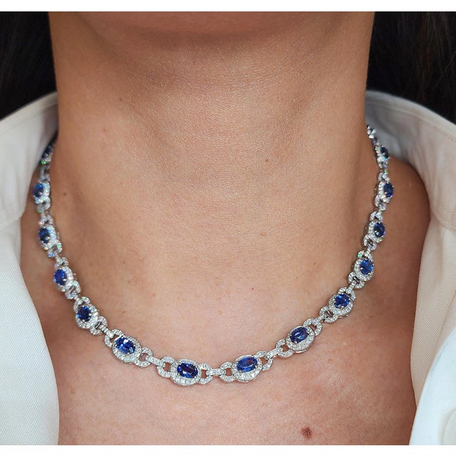 This exquisite necklace features 13.20 carats of 23 oval-cut blue sapphires. Accentuated by 5.15 carats of 737 round-cut...