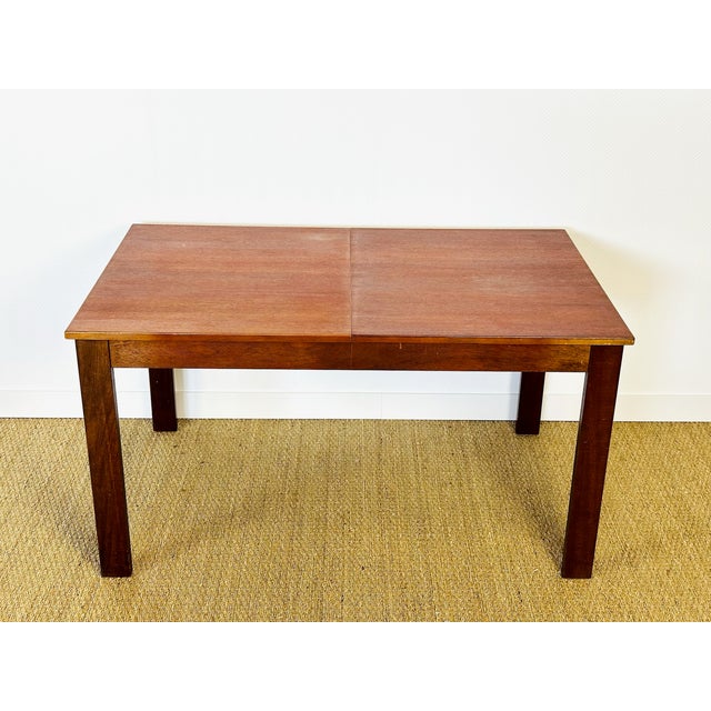 This elegant rectangular wooden table features a simple and timeless design, ideal for both classic and contemporary...