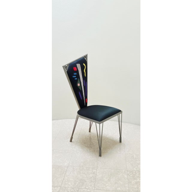 Incredible artist made sculpted steel chair with intriguing mixed textile upholstery. No signature or maker's marks....