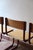 A set of four Scandinavian cantilever chairs, stamped Randers Møbelfabrik, 1960s. Moulded beech shells on a red lacquered...
