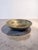 A sculptural mid-century brutalist centerpiece bowl featuring a shallow flared vessel supported by three raw cast...
